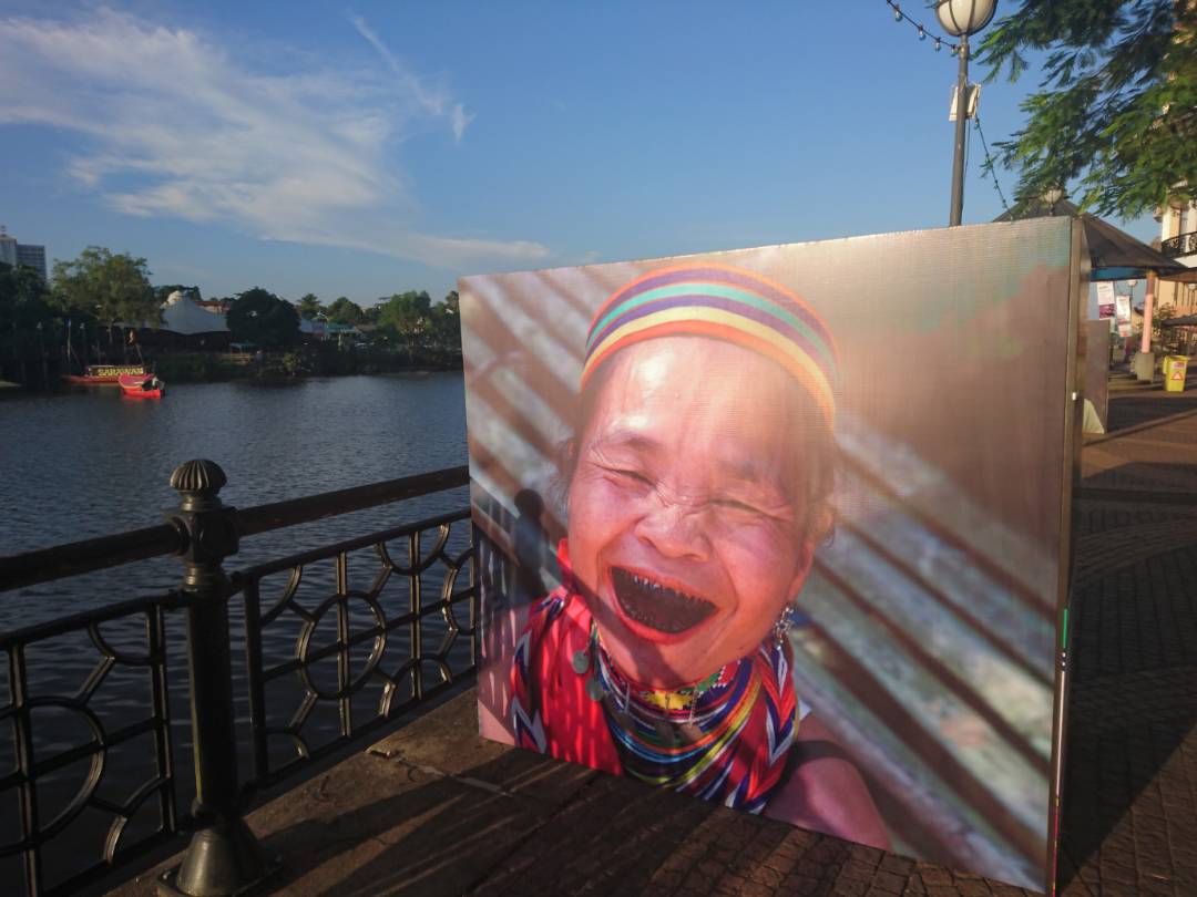 Image shows one of WAK2017, a photograph gallery along the Kuching Waterfront, here displaying a Bidayuh woman from Semban.